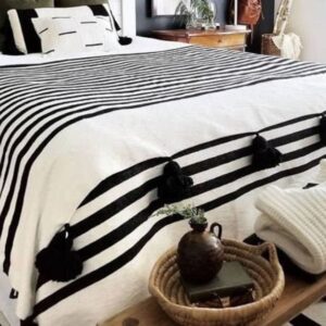 Moroccan tassel blanket with black and white poms